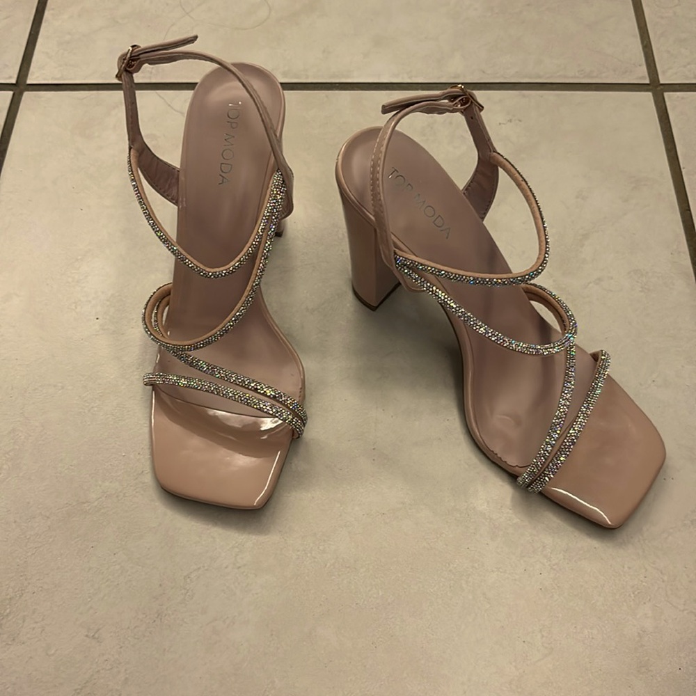 Tan colored shoes with rhinestones, perfect for a wedding